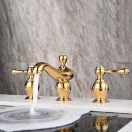 Robinet de lavabo doré à...